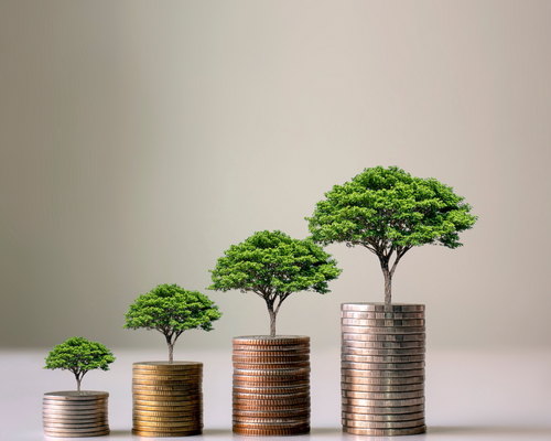 Trees growing on stacks of coins.